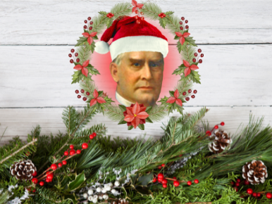 Head shot of William McKinley positioned in a Christmas wreath wearing a Santa Claus hat!